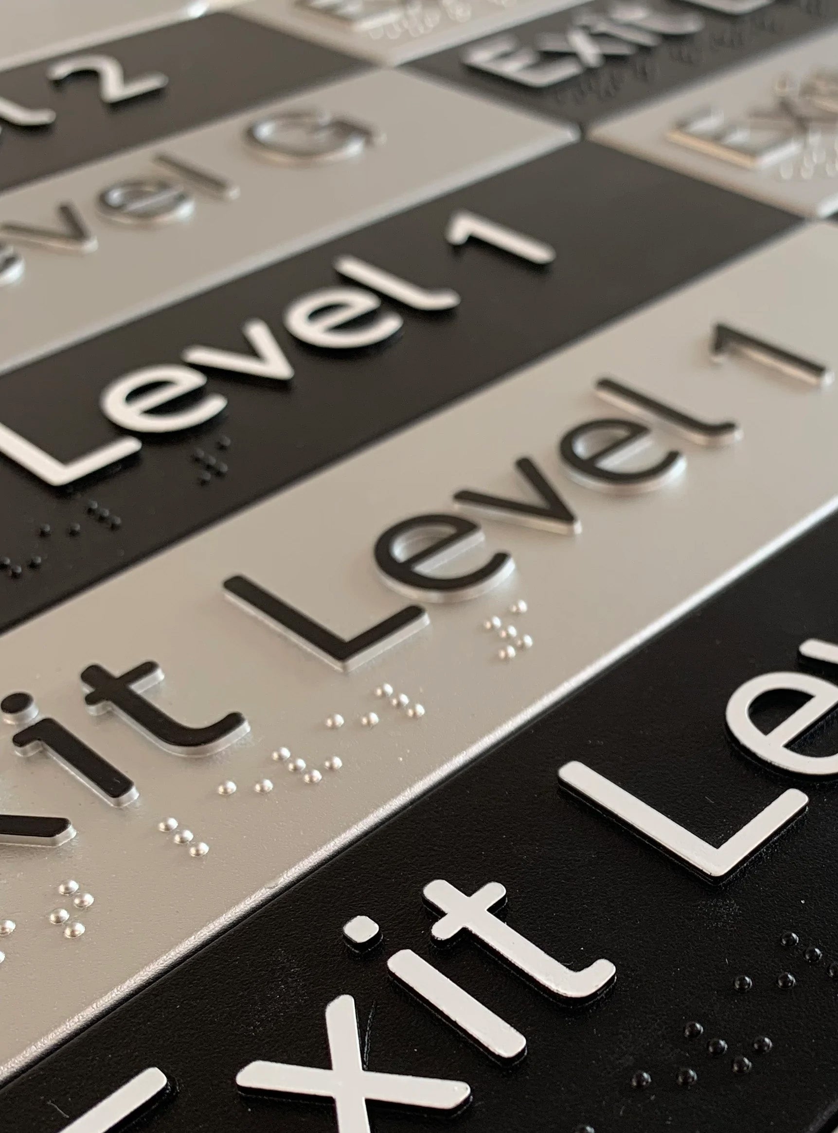 Exit Level Braille & Tactile Signs