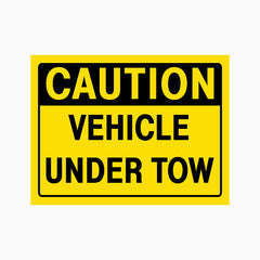 CAUTION VEHICLE UNDER TOW SIGN