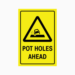 CAUTION POT HOLES AHEAD SIGN